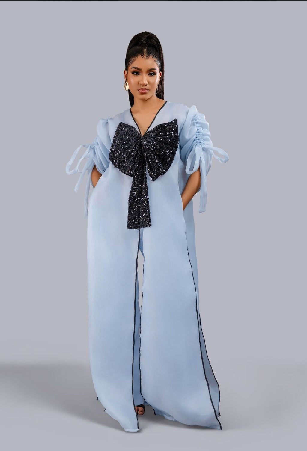 Blue kimono with black bow sequin and wide leg pant set.